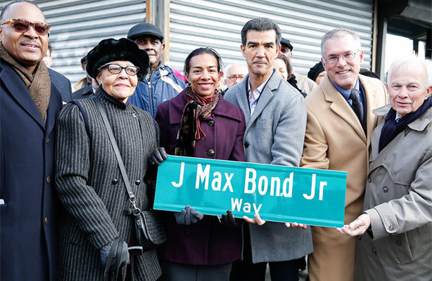 group photo with new street sign