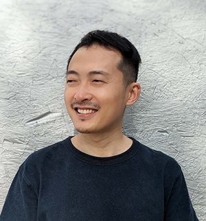 Headshot photograph of Professor Zihao Zhang smiling and looking slightly to the left.