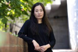 Headshot of Leena Cho, dressed in black, looking at the camera.