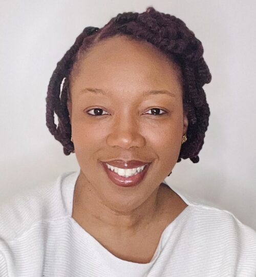 Headshot of Ifeoma Ebo, smiling at the camera.