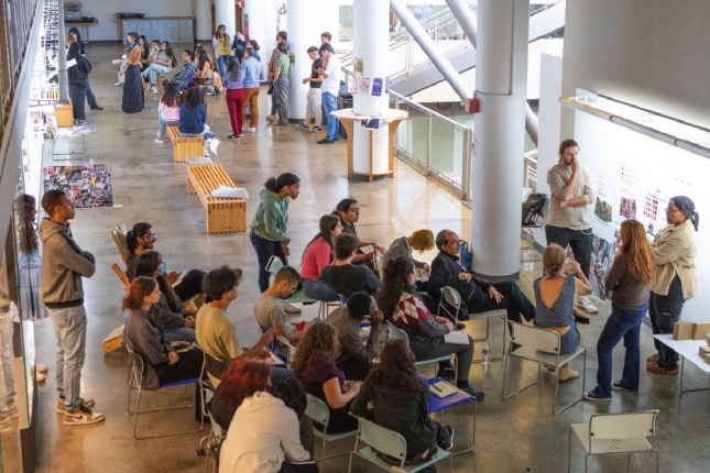 Group of students seated during a final review.