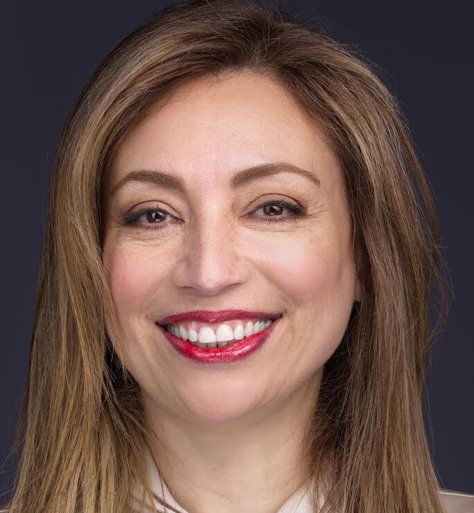 Headshot of Sara Jazayeri, looking at the camera and smiling.