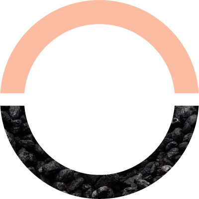 Graphic of a circle; the upper half is coral pink and the bottom half features a photo of rocks.